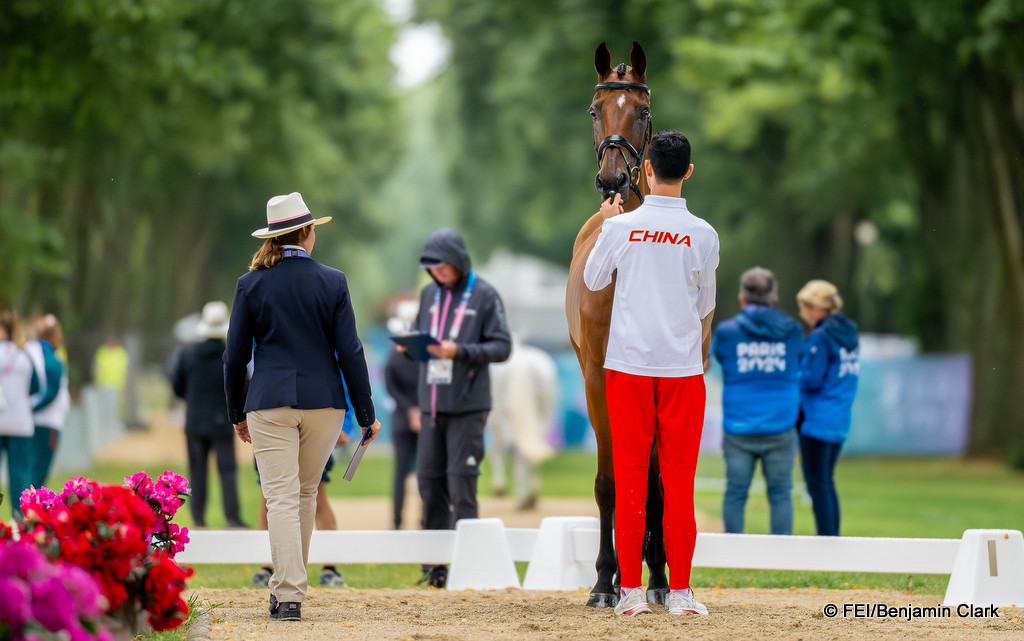 Alex Hua Tian ((China) presents Jilsonne Van Bareelhof during the first horse inspection for the eventing at the Chateau de Versailles, Paris 2024 Olympic Games | An Eventful Life